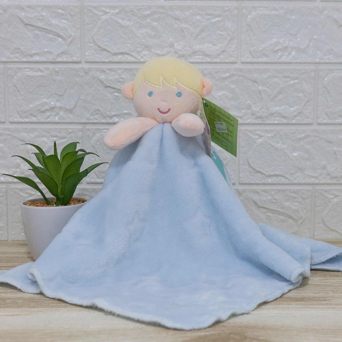 doudou carita niño rubio